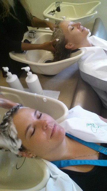 Women getting hair washed at a salon. 