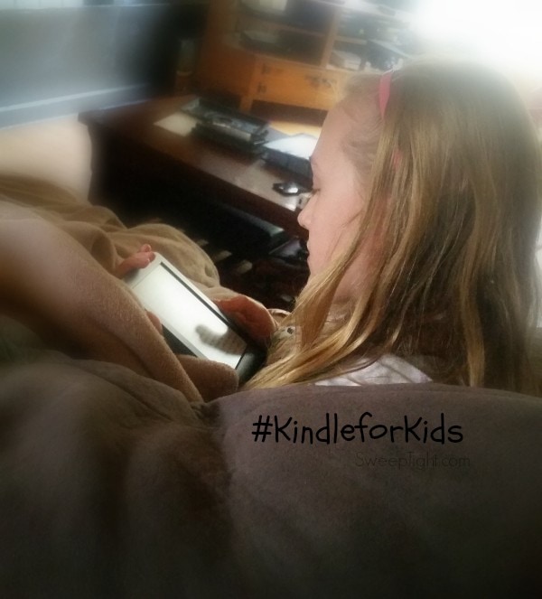 Chesney reading on her Kindle. 