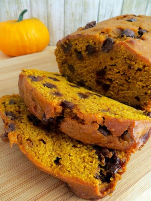 Chocolate chip pumpkin bread sliced on a board. 