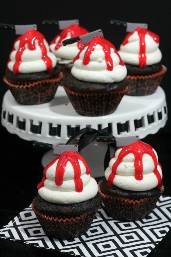 Cupcakes with bloody knife toppings for Halloween.