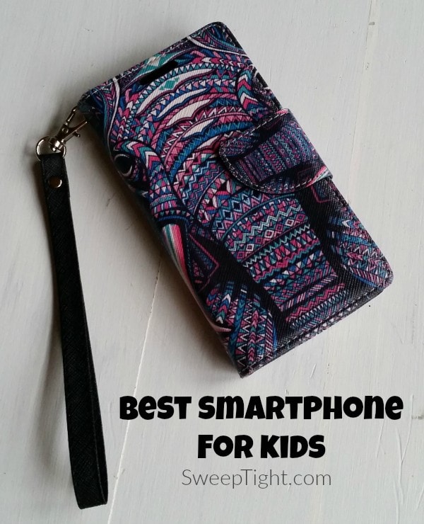 A phone in a purple and pink case. 