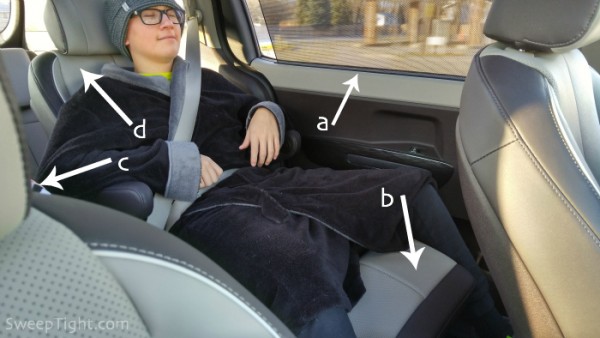 Adam in the 2016 Kia Sedona backseat. 