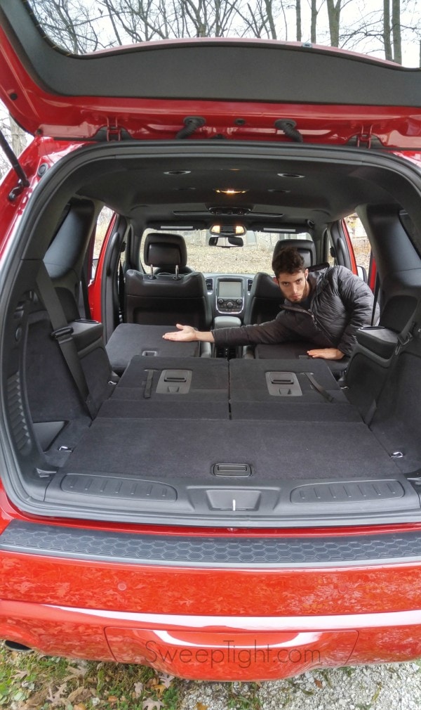 Evan displaying the seating of the 2015 Dodge Durango. 