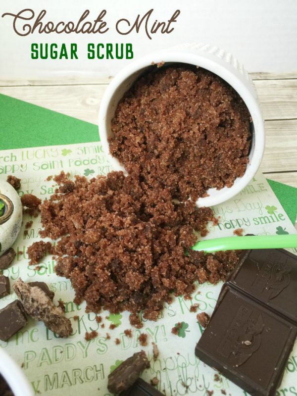 Chocolate sugar scrub spilling out of a ramekin next to chocolate. 