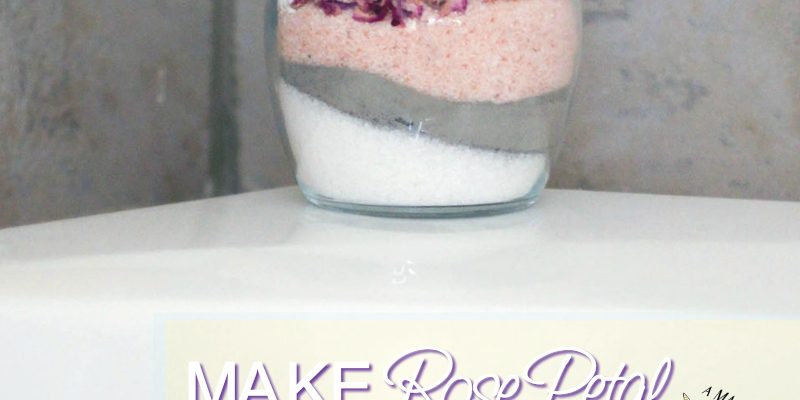 Rose Petal Bath Soak layered in a jar on the tub.