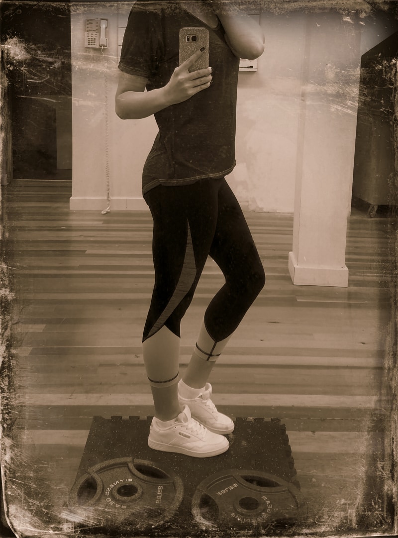 Shelley wearing Reebok Classic shoes in the gym.