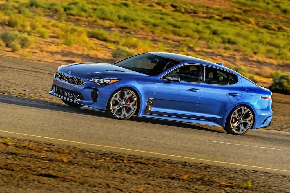 Blue 2018 Kia Stinger on the road.