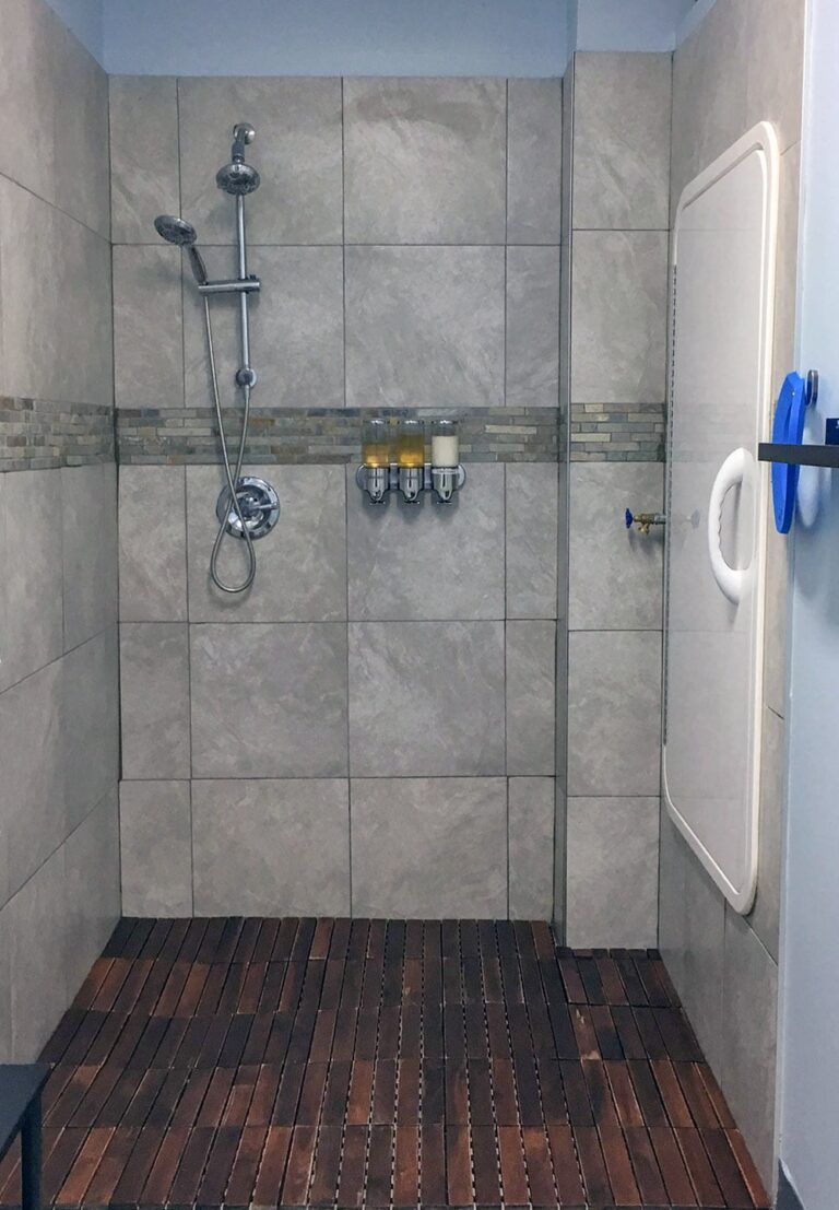 Shower next to the sensory deprivation tank door.