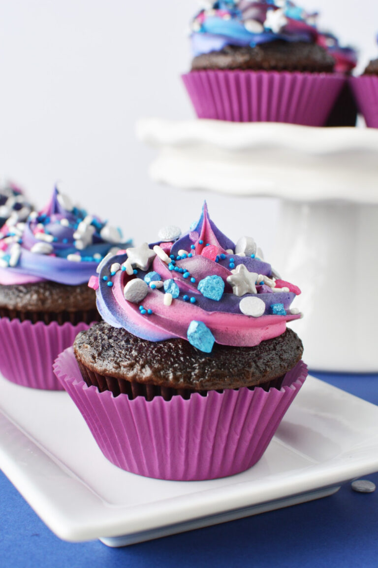 decorated cupcakes on white dishes