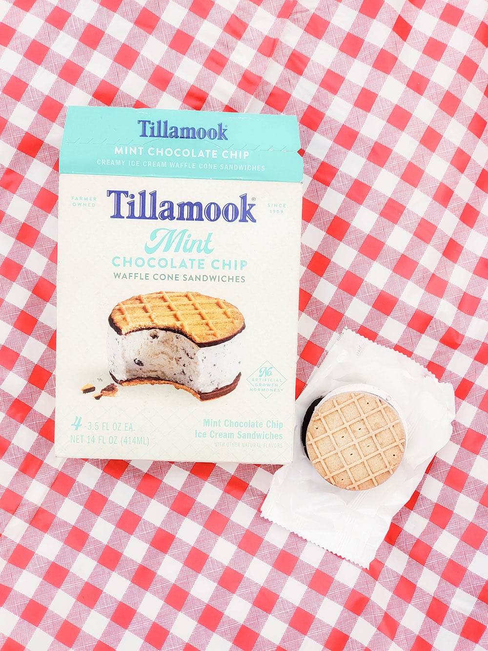 Tillamook Ice Cream sandwiches on a picnic blanket.
