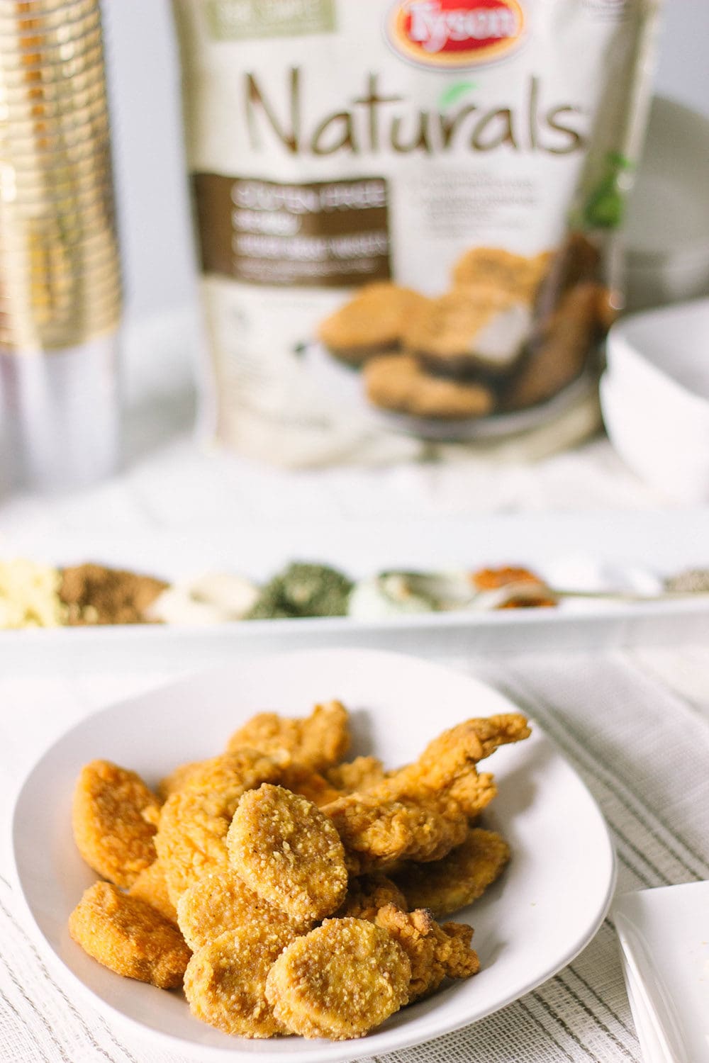 Chicken strips and nuggets with Tyson bag in the background. 