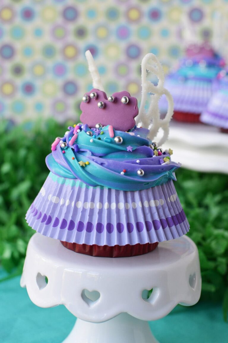 Finished fairy cupcake with wings and skirt on a cake stand