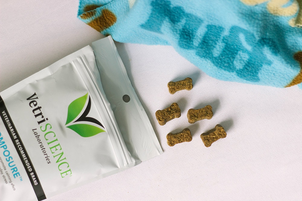 VetriScience chews on a table next to the bag and a dog blanket.