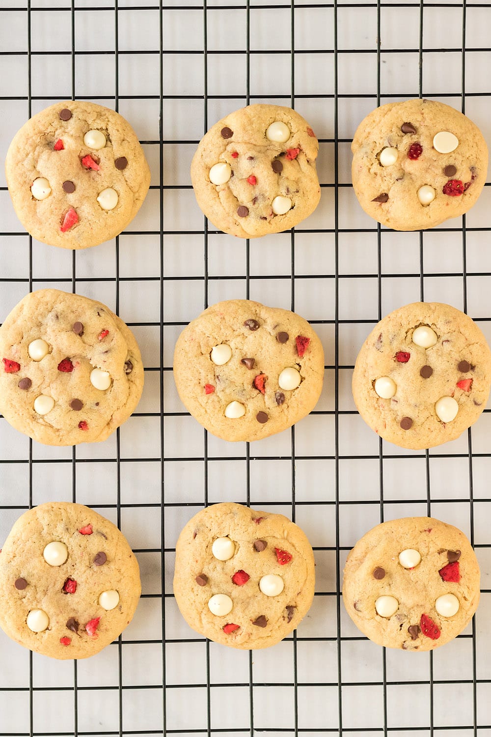 Cheesecake cookies on cooling rack.