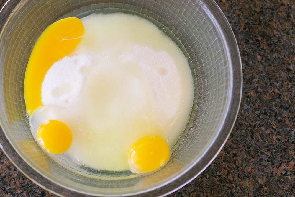 Eggs and sugar in a bowl.