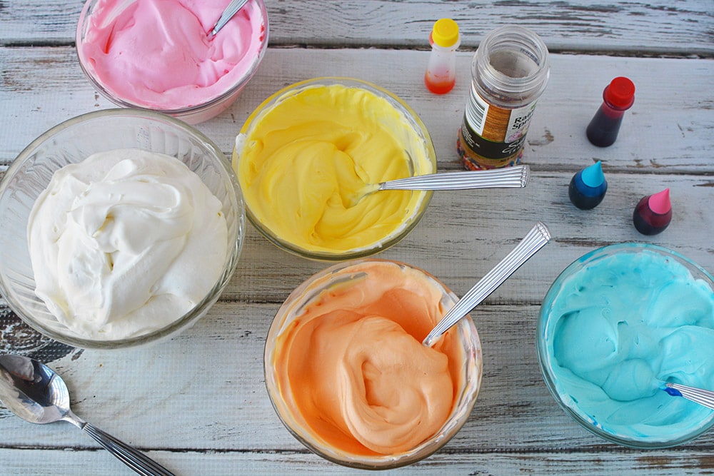 Colored bowls of ice cream mixture.
