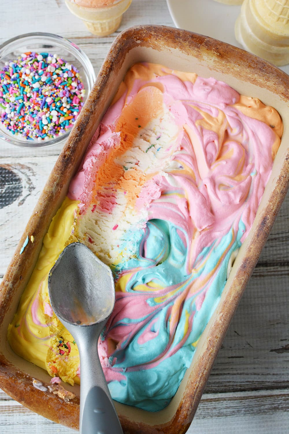 Unicorn ice cream with an ice cream scoop.