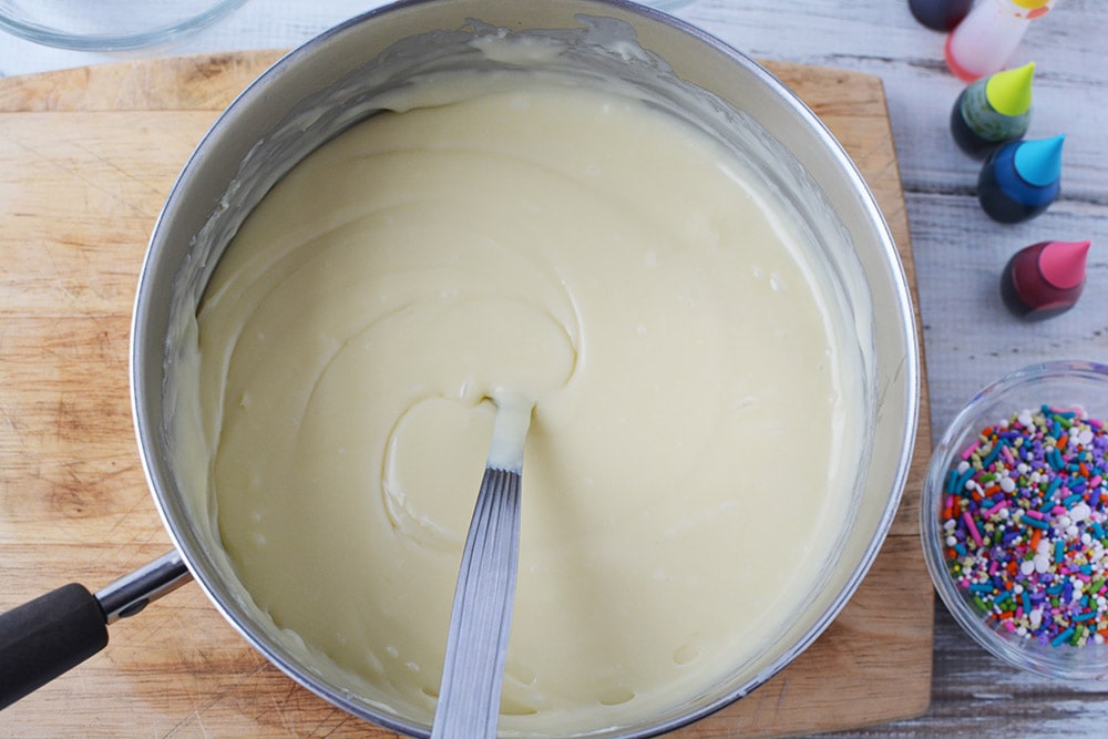 Stirring melted chocolate chips.