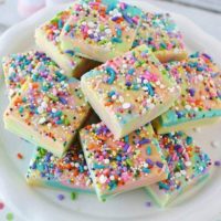 Rainbow unicorn fudge on a plate in slices