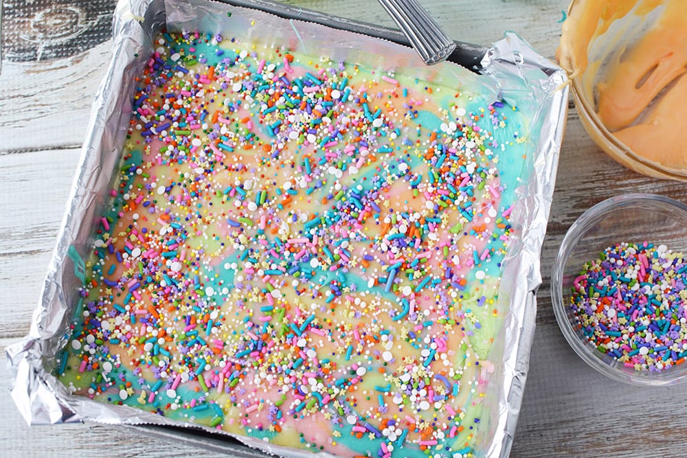 Sprinkles on top of fudge in a pan.