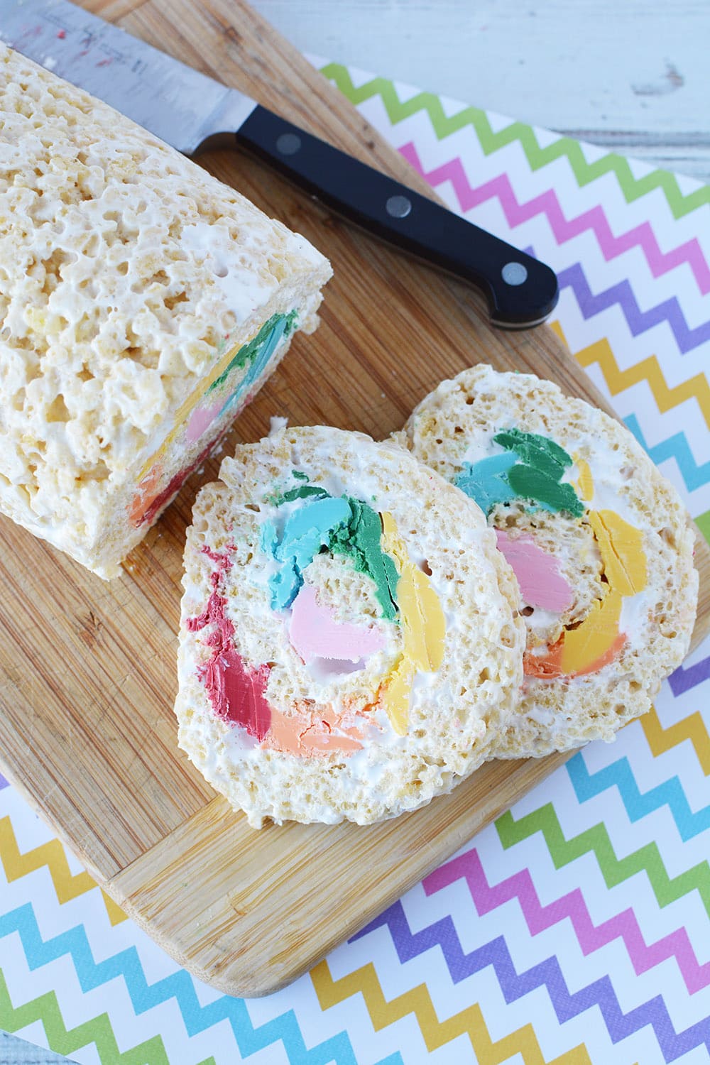 Sliced rainbow pinwheel rice krispie treat.