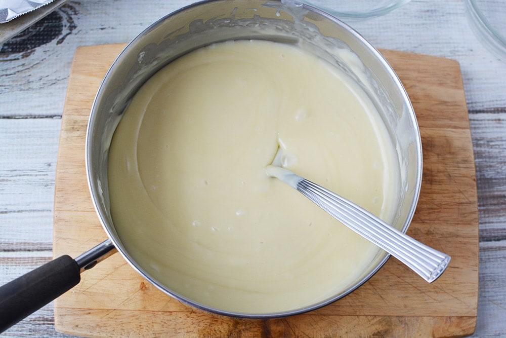 Stirring melted white chocolate mixture. 