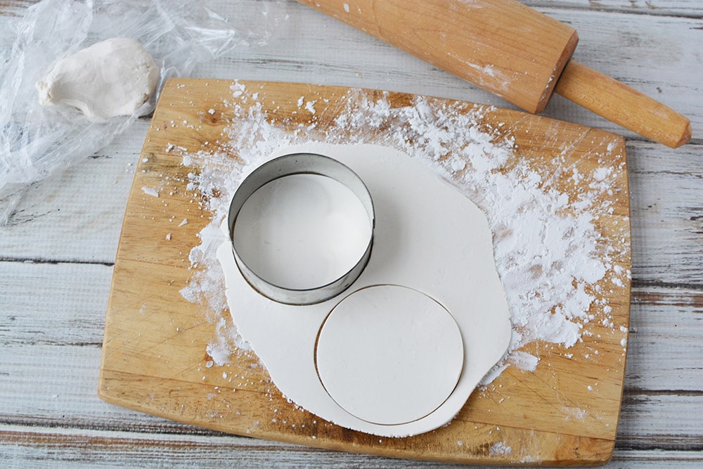 Cutting circles into candy clay.