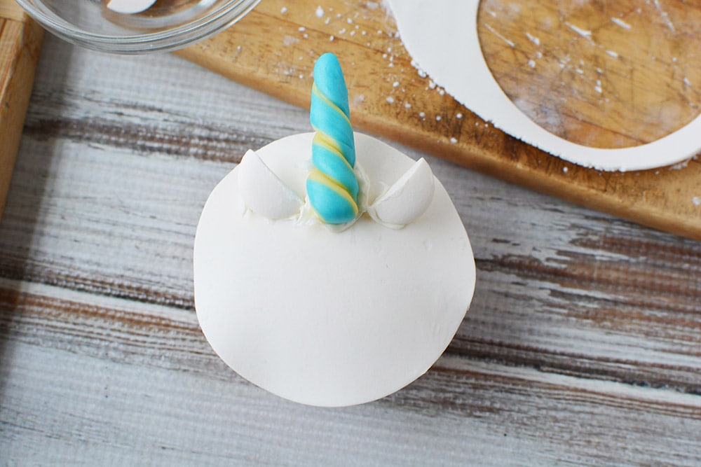 Candy horn and ears on a cupcake.
