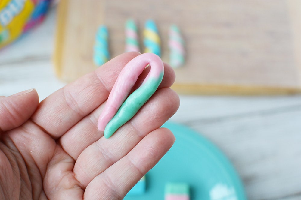 Folding a rolled Starburst candy.