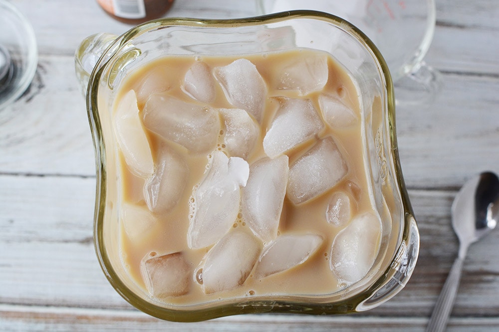 Ice in a blender with coffee mixture. 