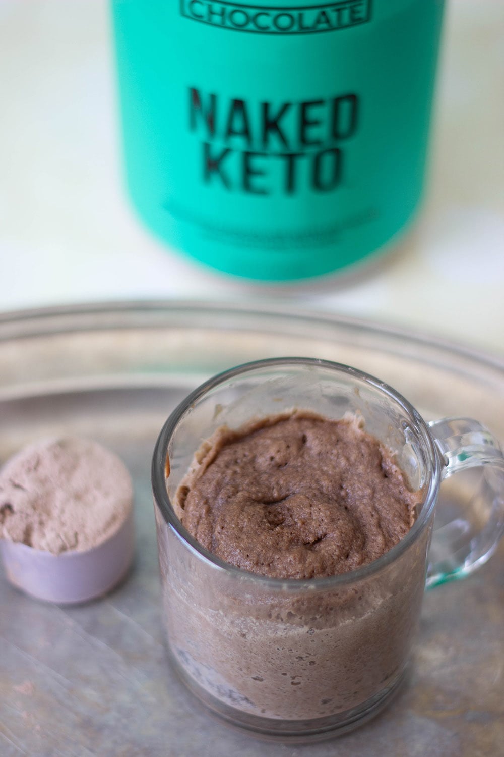 Chocolate keto mug cake in a clear mug.