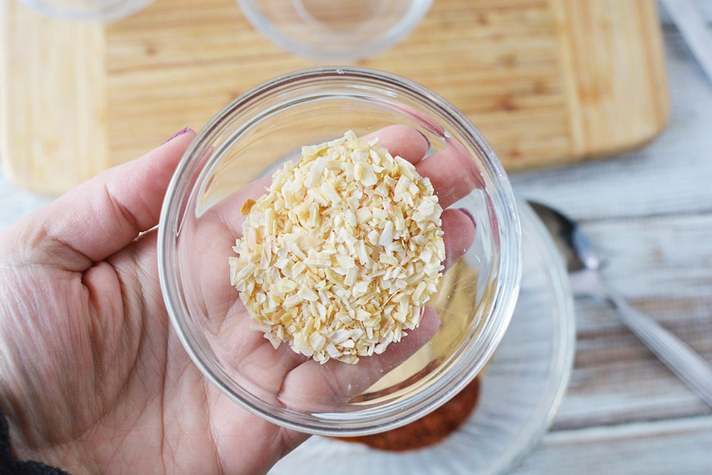 Holding a bowl of onion mix. 