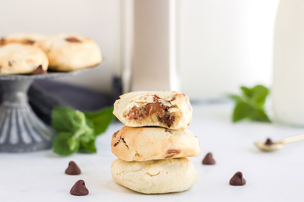 Cookies stacked in front of an air fryer.