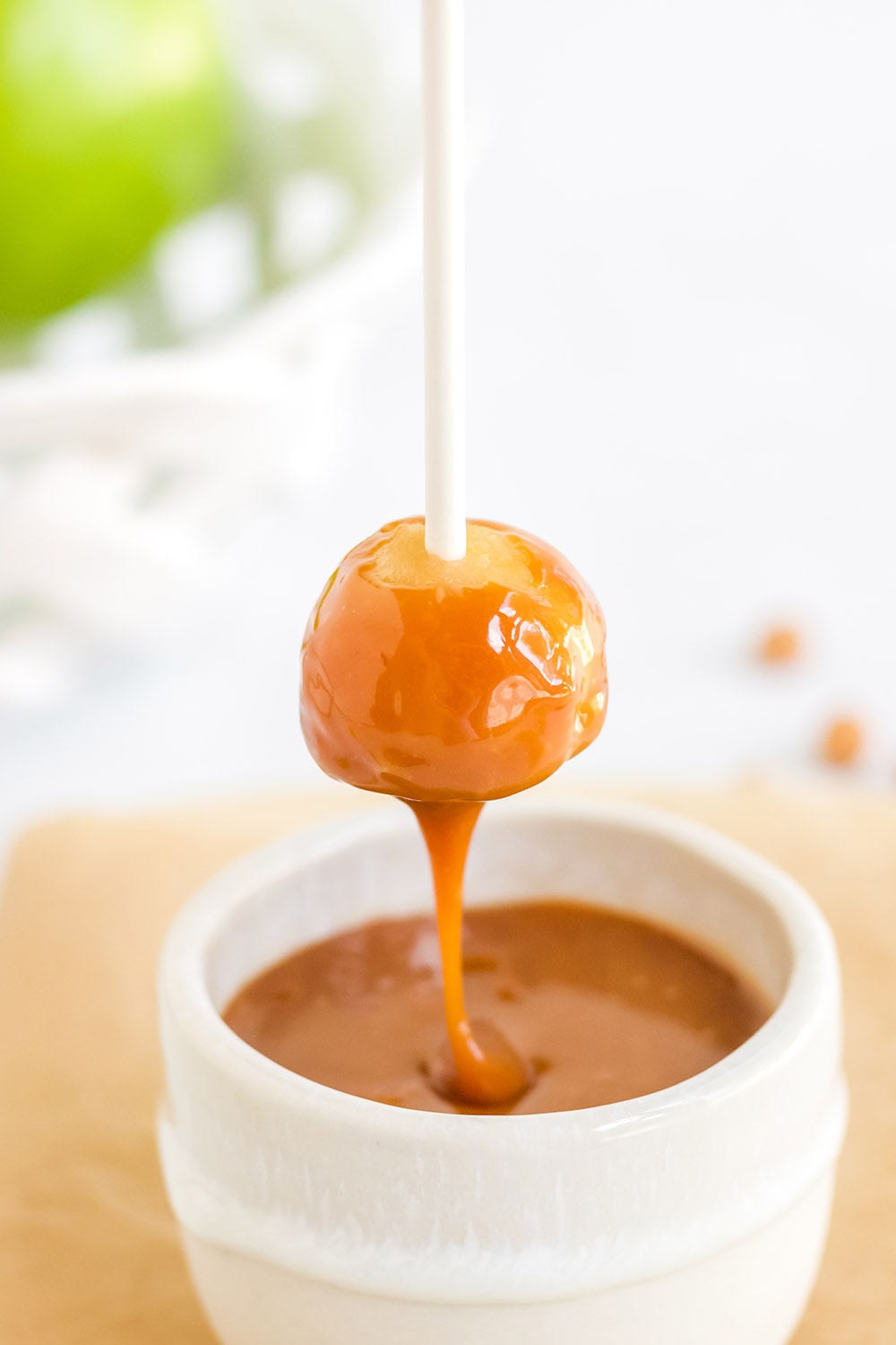 Caramel dripping off apple.