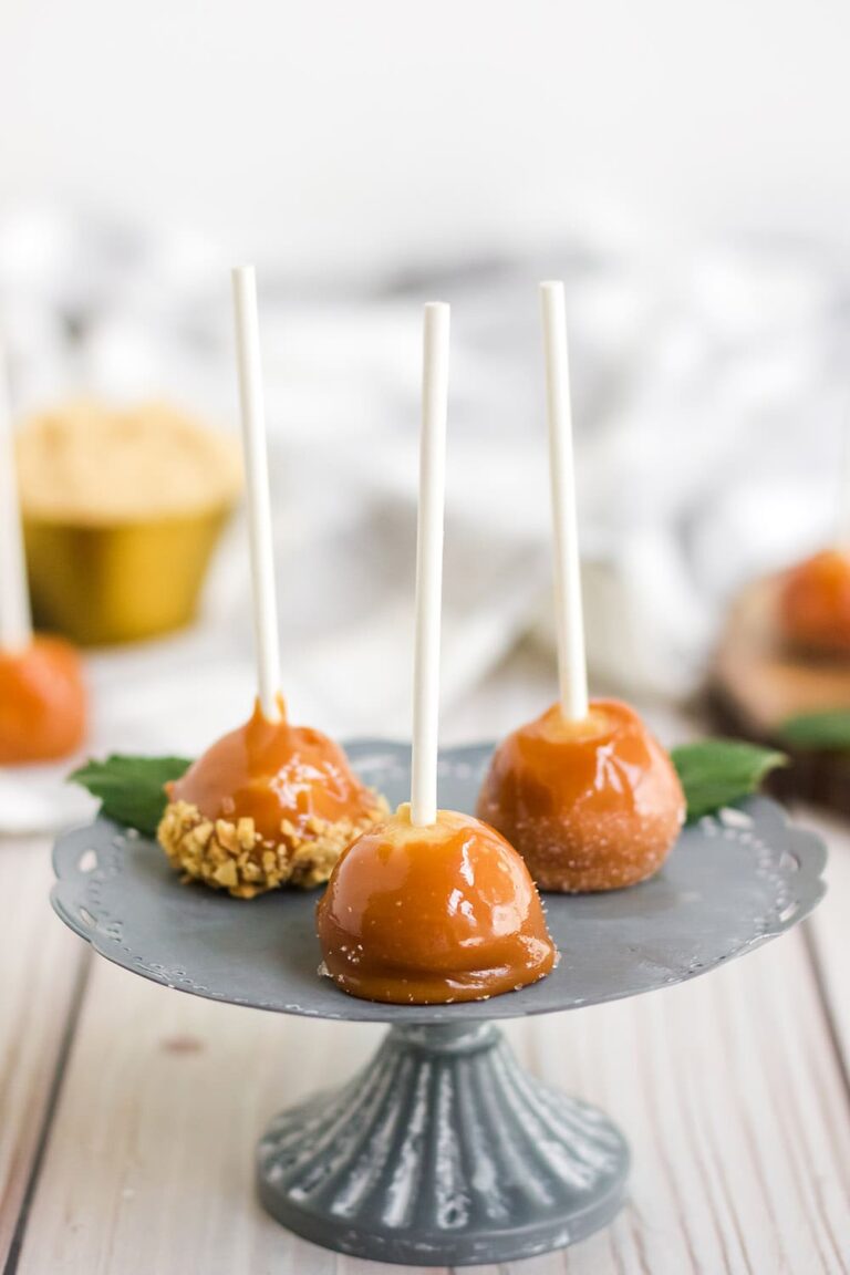 tiny caramel apples on a silver stand