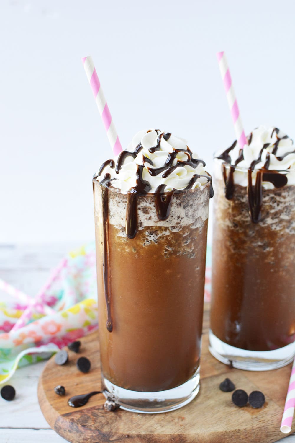 Two java chip frappuccinos on a board.