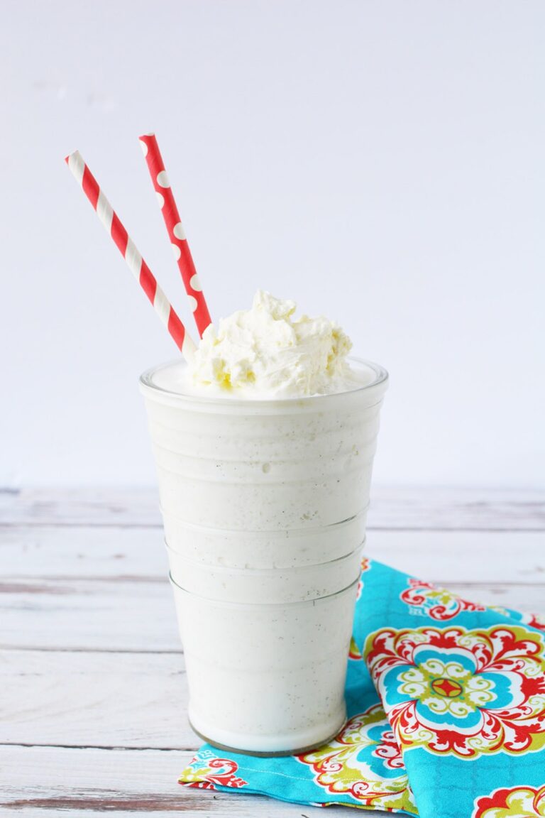Vanilla bean frappuccino topped with whipped cream in a glass