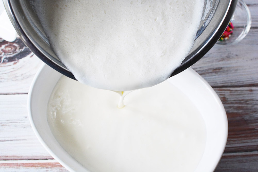Pouring ice cream mixture into a dish.