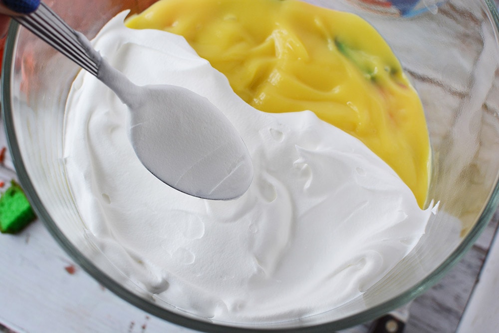 Whipped cream on top of pudding in trifle.