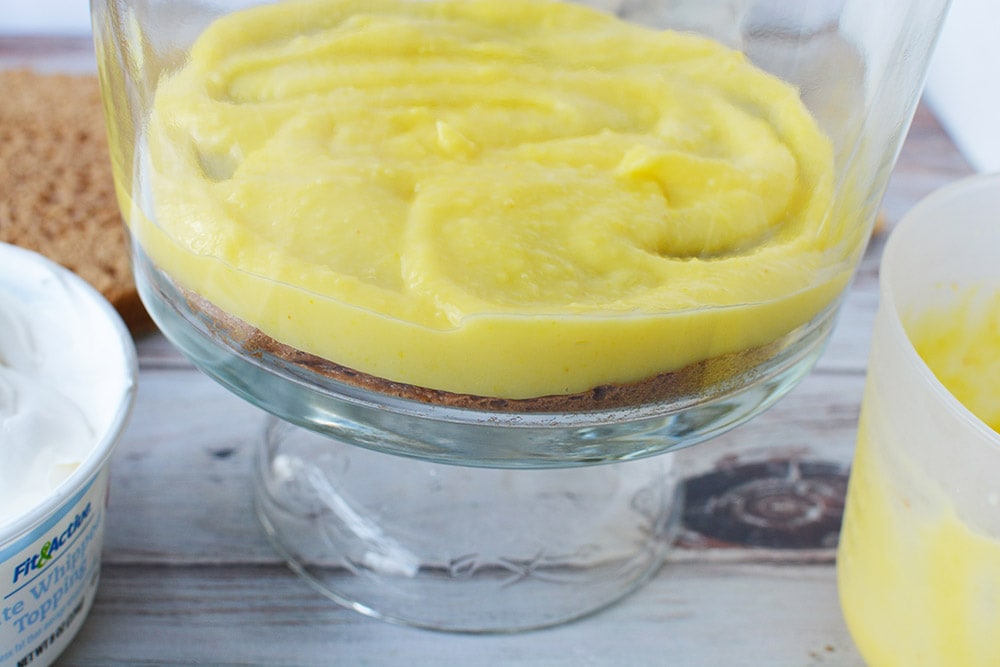 Pudding on top of cake in a trifle.