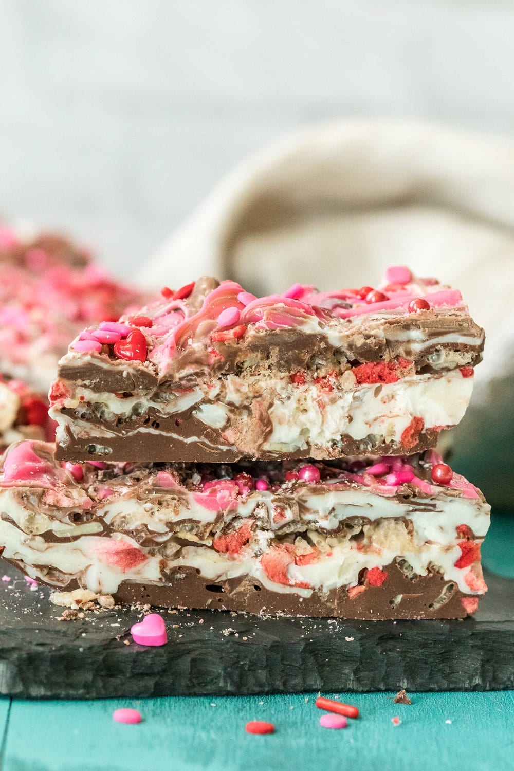 Bark candy stacked on a board.