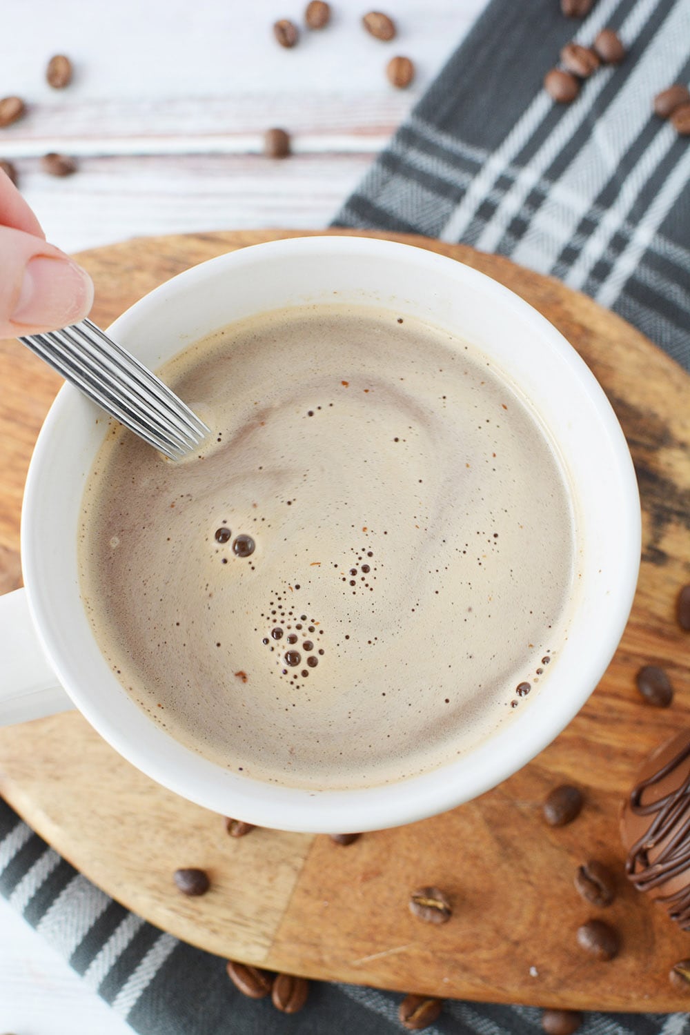 Stirring a cup of coffee.