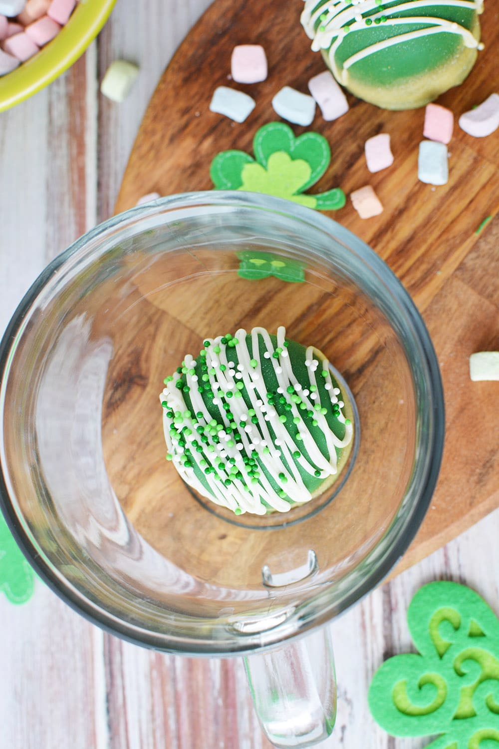 St. Patrick's day cocoa bomb in a glass mug. 