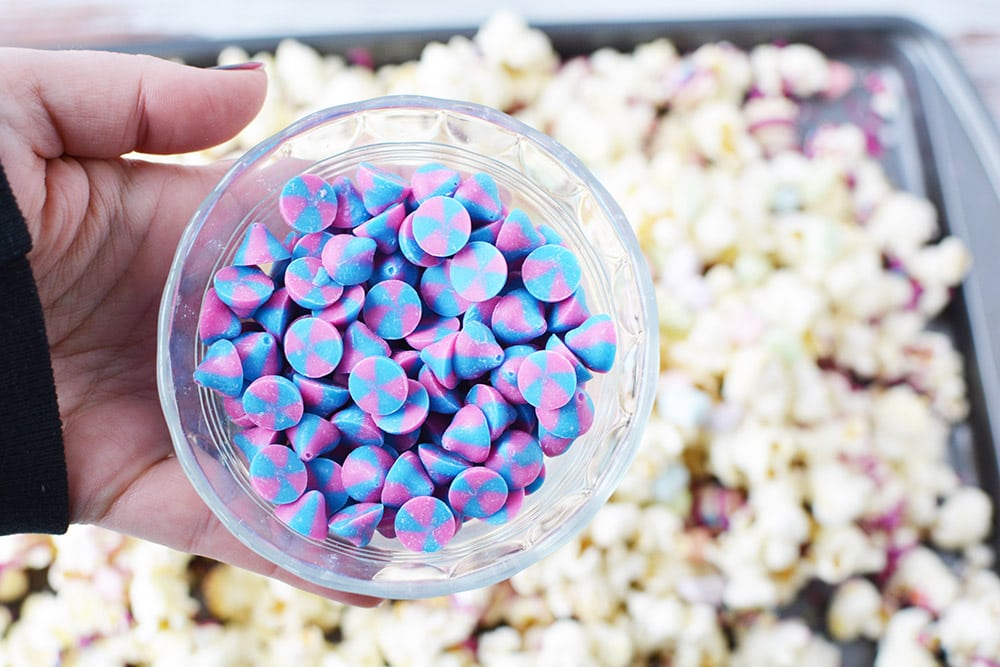Bowl of unicorn chips over popcorn.