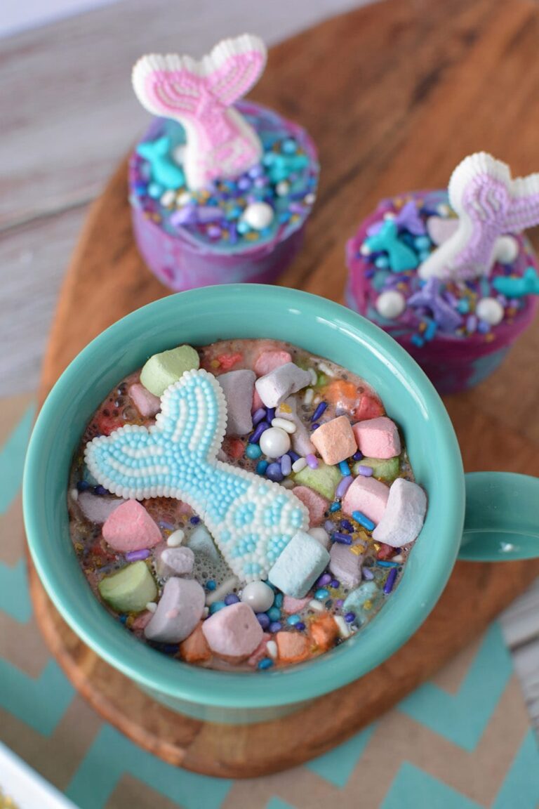 Mermaid tail floating in a mug of hot cocoa.