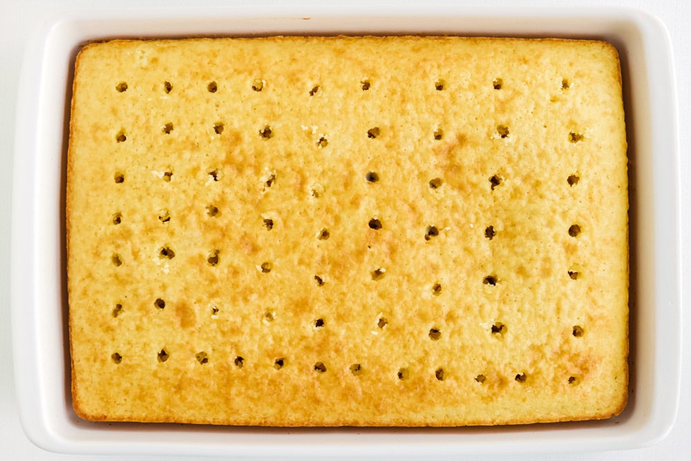 Cake in a pan with holes poked in it.