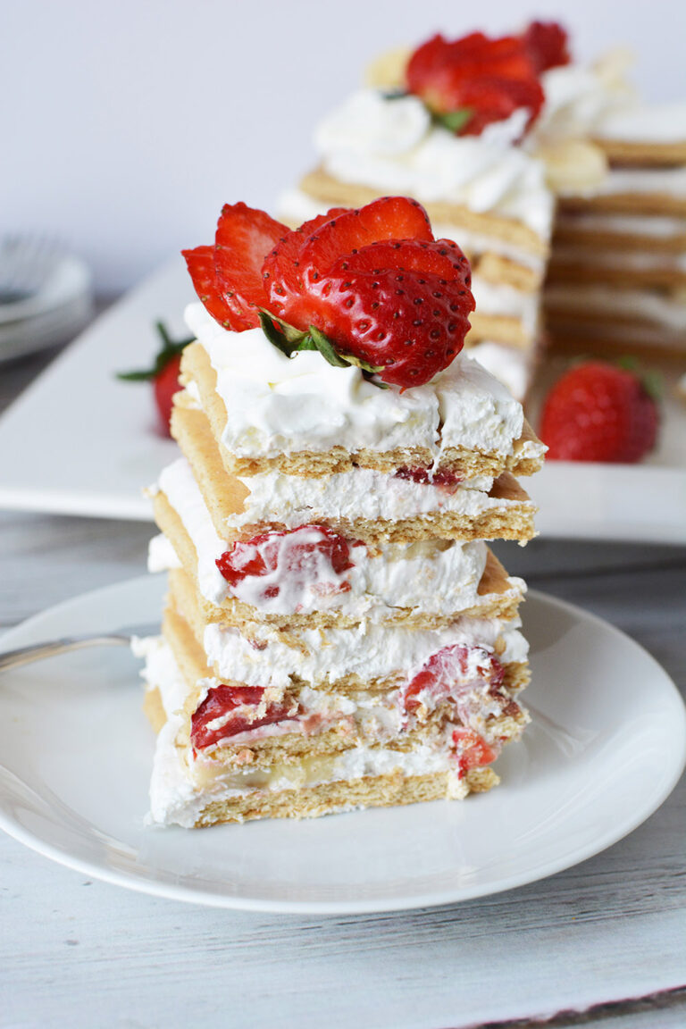 Banana split ice box cake on a plate.