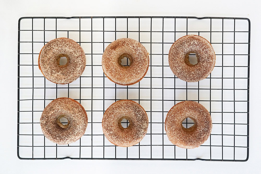 Donuts on a wire rack.