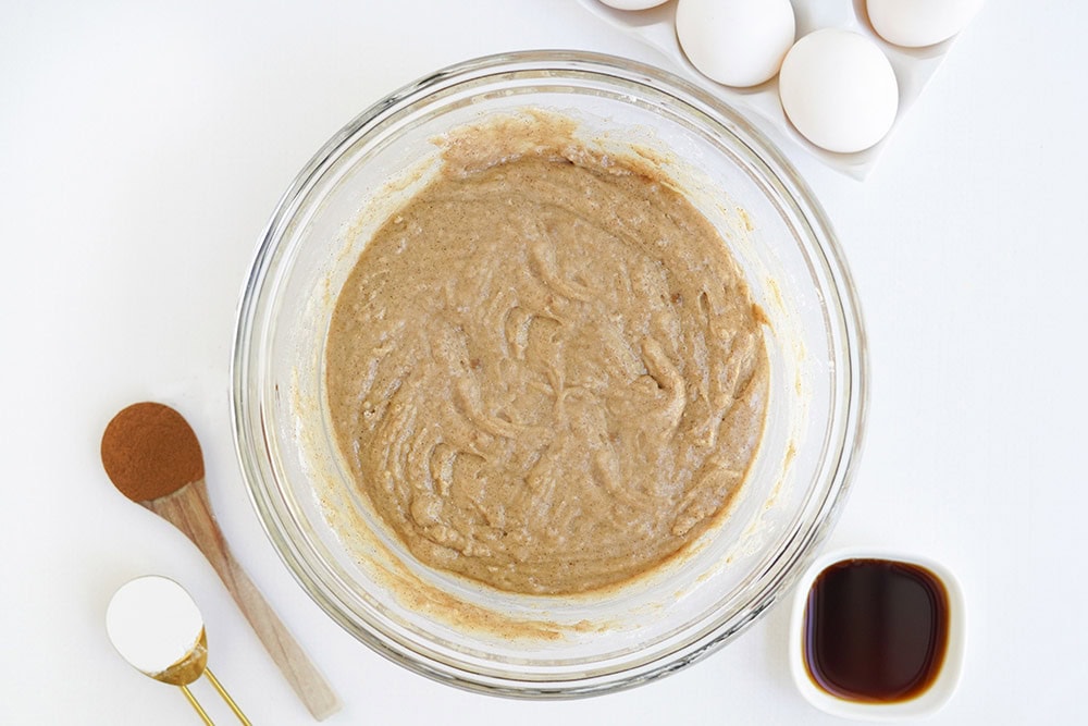 Batter for apple cider donuts in a mixing bowl.