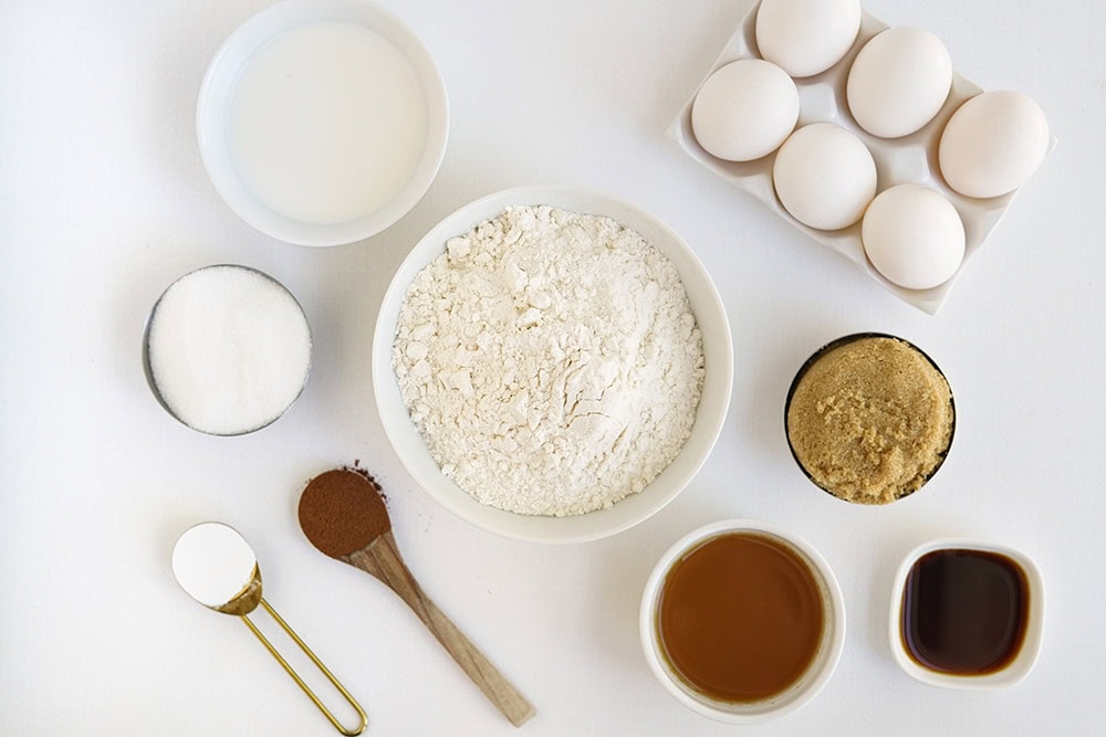 Bowls of ingredients including, eggs, flour, cinnamon, and other ones.